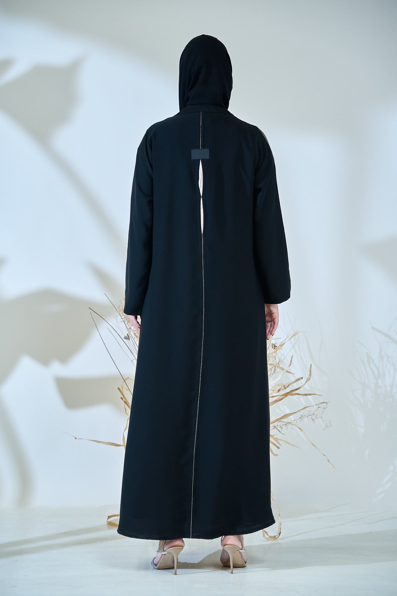 Black Abaya with Abstract Cut-Out Sunburst Design